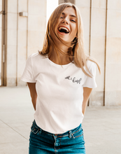 Load image into Gallery viewer, Woman wearing white t-shirt with a picture of a bumble bee and the word kind.