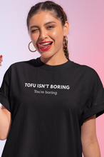 Load image into Gallery viewer, Woman wearing black vegan t-shirt with the words tofu isn't boring, you're boring