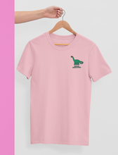 Load image into Gallery viewer, Urban herbivore vegan t-shirt in pink on a hanger.

