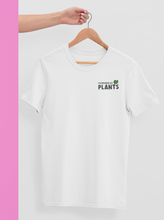 Load image into Gallery viewer, Powered by plants shirt on a hanger
