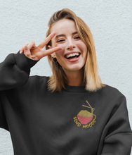 Load image into Gallery viewer, Model wearing black send noods embroidered sweatshirt. 
