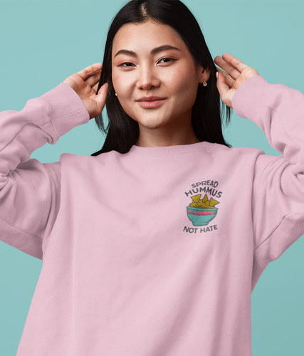 Asian model wearing pink embroidered spread hummus not hate vegan sweatshirt.