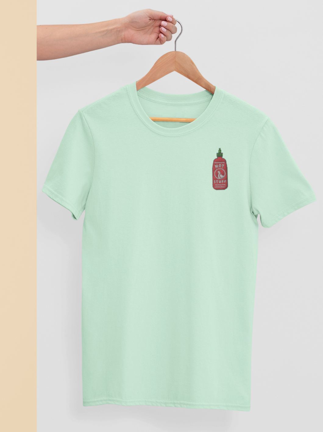 Sriracha shirt on a hanger